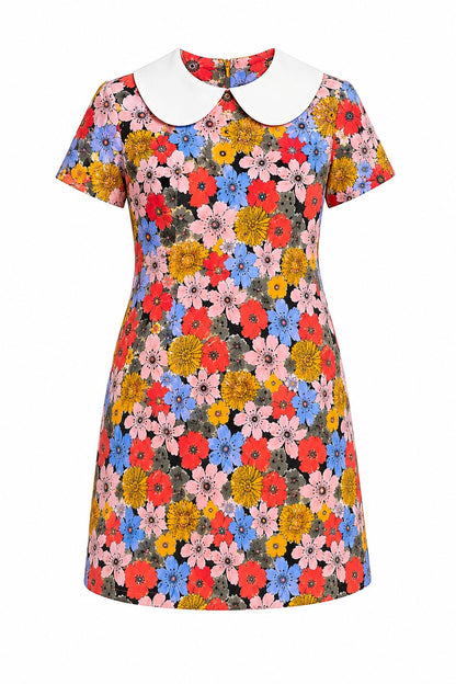 Colorful floral dress with a white collar on a white background